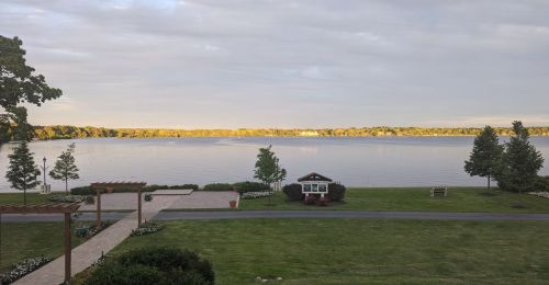 A landscape view of a lake and grassy shoreline.