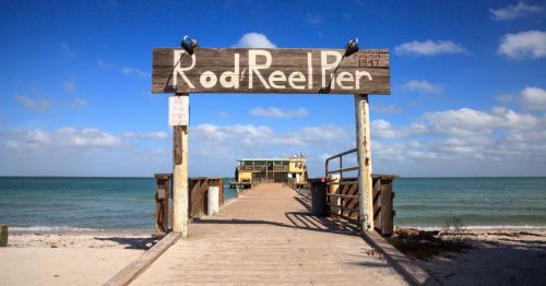 The sign at the Rod and Reel Pier along the dock at Anna Maria Island, Florida, on a sunny day