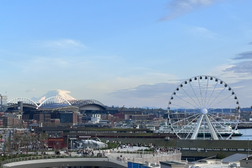 Mount Ranier and a ferris wheel near Seattle's waterfront