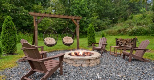 A large outdoor fire pit with ample seating in an Airbnb in Kentucky.
