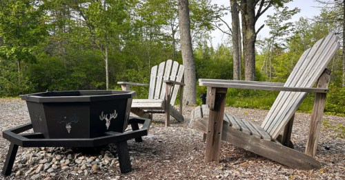 A fire pit with chairs at an Airbnb near Acadia National Park in Maine.