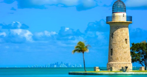 Views of the Boca Chita Lighthouse surrounded by blue waters at Biscayne National Park near Miama, FL.