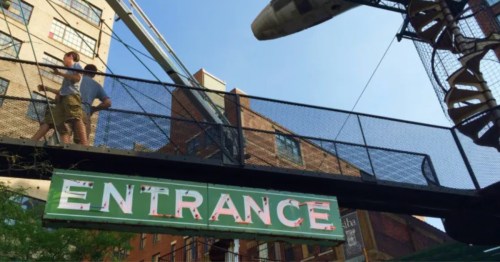 A large green entrance sign for a museum in Missouri.
