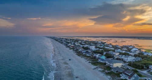 A drove view of a sunset over Topsail Beach, North Carolina.