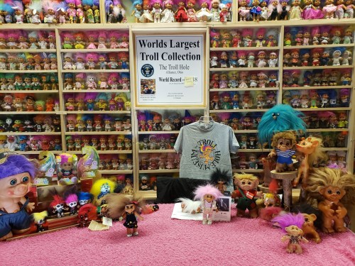 Rows of troll dolls in museum exhibit