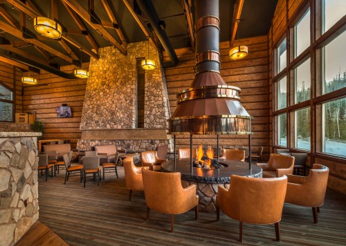 A cozy fireplace and seating inside Brian Head Lodge