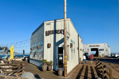 Exterior of Mersea's Seafood Restaurant on a dock in Avila Beach, CA