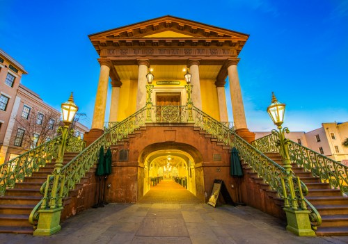 The entrance to Charleston City Market, an old columned Greek style building.