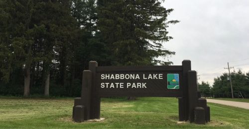 A wooden sign for Shabbona Lake State Park
