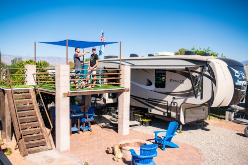 RV parked at campsite with platform