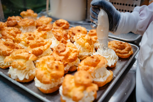 person making cream puffs