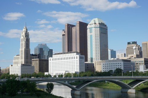 Downtown Columbus, Ohio skyline with LeVeque Tower on the far lefthand side on a sunny day.