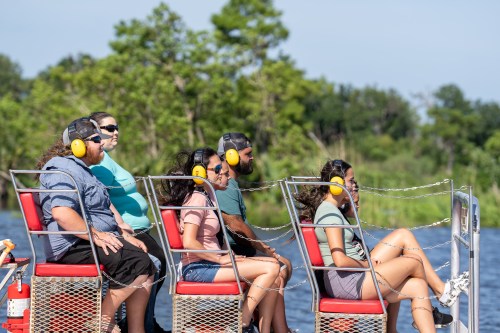 People aboard a small boat group tour