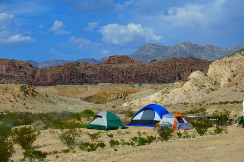 A handful of tents in front of mountains in the desert of Southwest Texas (Big Bend National Park)