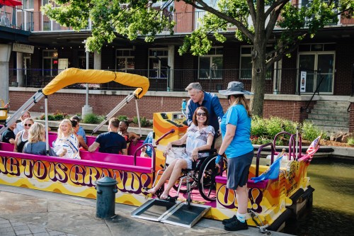 People relax before getting on a boat ride in OKC