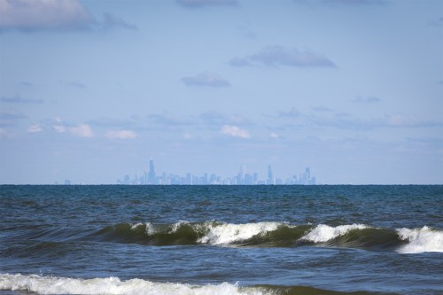 Lake Michigan waves with Chicago skyline in the distance at Indiana Dunes National Park