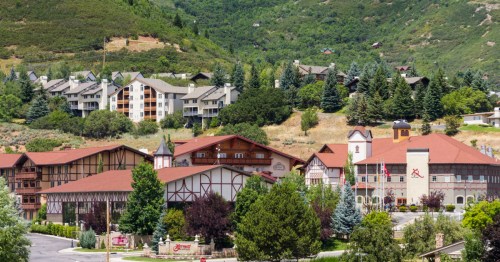 A resort with Swiss influence sits on a green mountain near Midway, Utah.