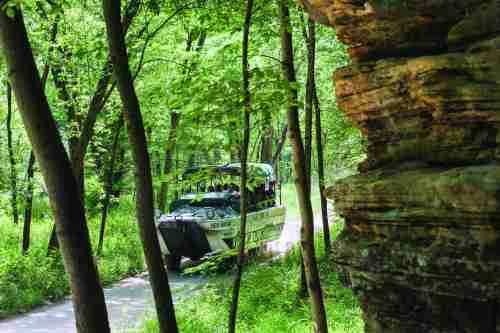 An Original Wisconsin Ducks boat traversing one of the land trails
