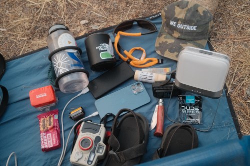 Outdoor gear spread out on blanket