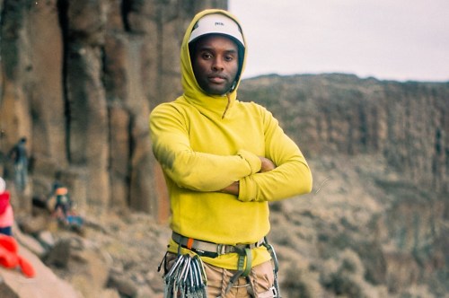 Man posing in rock climbing gear