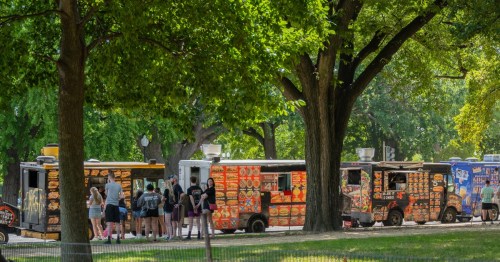 Taco trucks line a street