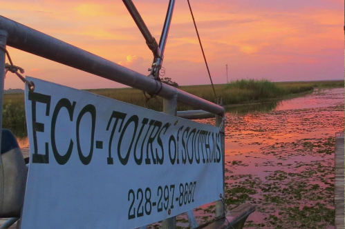Side of a tour boat at sunset on a river in Mississippi