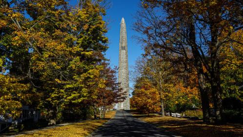 The Bennington Battle Monument surrounded by autumn trees in Bennington, Vermont.