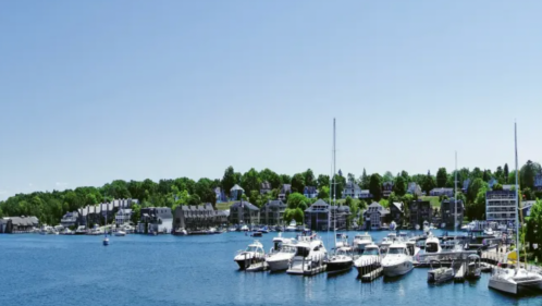 Boats on the harbor in Charlevoix, MI on a beautiful sunny day in the summer.