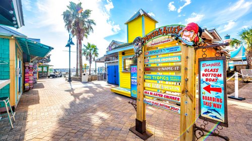 Okaloosa beach city sign for Harbor Boardwalk Pirate's Alley on sunny winter day in Florida panhandle Gulf of mexico