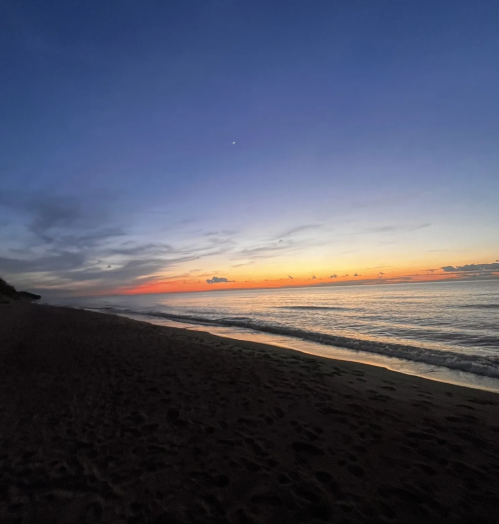 The sun almost set as Central Avenue Beach is lowered into darkness
