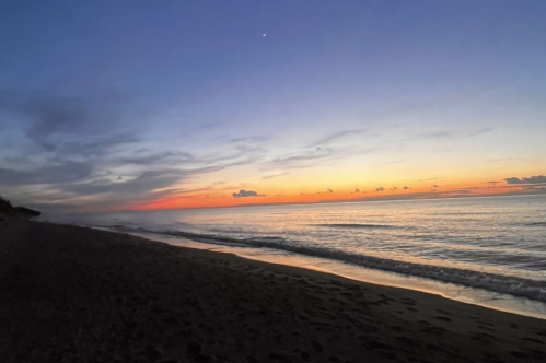 The sun almost set as Central Avenue Beach is lowered into darkness