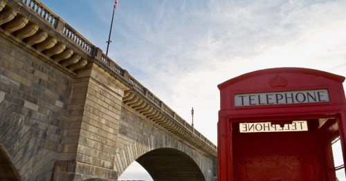 a london telephone booth in front of the london bridge in lake havasu city arizona