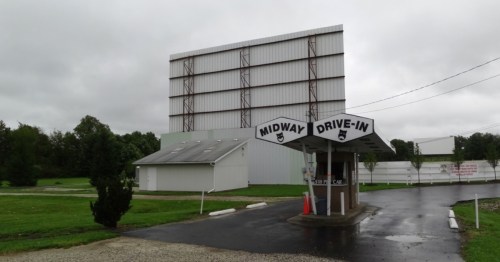 Exterior of grey building with sign "Mid-way Drive In" in Ohio