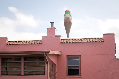 Rainbow Cone pink building with ice cream sculpture on the roof
