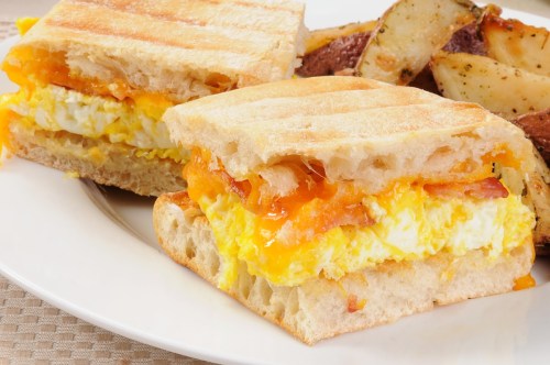 Halved ciabatta breakfast sandwich.