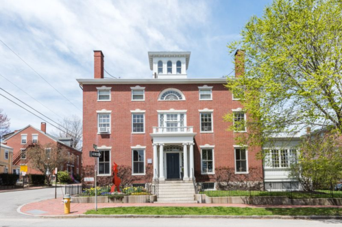 The exterior of the Danforth building, one of the two buildings that make up the Blind Tiger Inn in Portland, Maine. The large Federal-style mansion is made from brick.