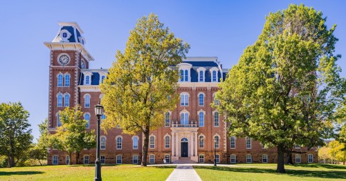 Sunny exterior view of the Old Main of University of Arkansas at Arkansas