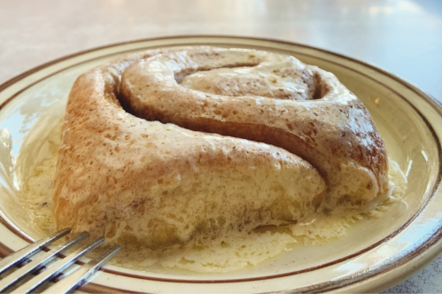 A close up of the giant sweet roll at Frontier on a white plate