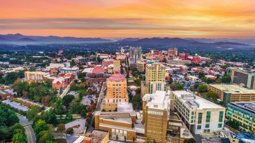 Bird's eye view of Asheville, NC at sunset.