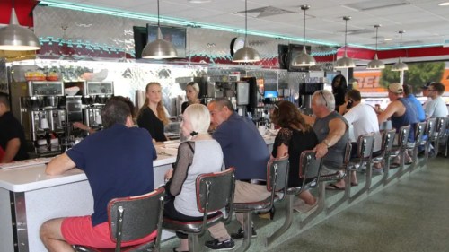 Patrons line up at the bar at Lester's Diner