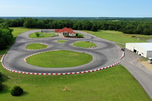 A Tuscan-style house is surrounded by a sprawling race track with loops and figure-eights at a unique Missouri Airbnb.