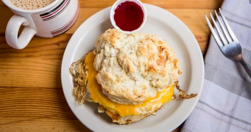 Ham, Egg, and Cheese Biscuit on a table from The Root Cafe in Little Rock, Arkansas