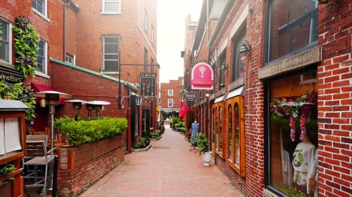 Red cobblestone and brick streets in historic New Hampshire on a beautiful summer day