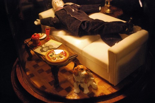 A doll with minature furniture and miniature dog at House on the Rock