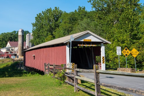 The Jackson's Sawmill Covered Bridge or Eichelberger's Covered Bridge spans the West Branch of the Octoraro Creek in Lancaster County, Pennsylvania. The bridge is purportedly the only covered bridge in the county that is not built perpendicular to the stream it crosses due to the placement of the sawmill on one side of the bridge and the rock formations faced by the builders on the other side. The bridge has a single span, wooden, double Burr arch trusses design with the addition of steel hanger rods. The deck is made from oak planks.