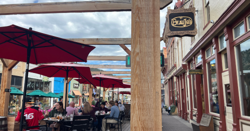 The parklet eating area in the street at Beau Jo's pizza