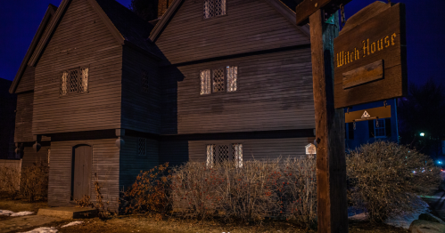 A nighttime view of the Salem Witch House in Salem, Massachusetts.