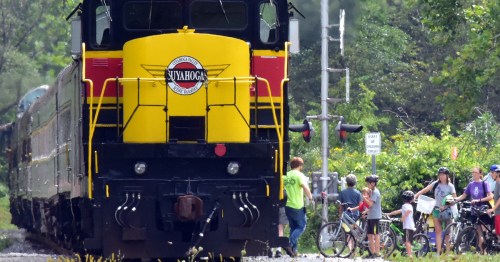 Bicyclists boarding a train