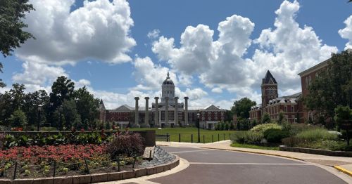 View of the University of Missouri with gardens in the foreground.