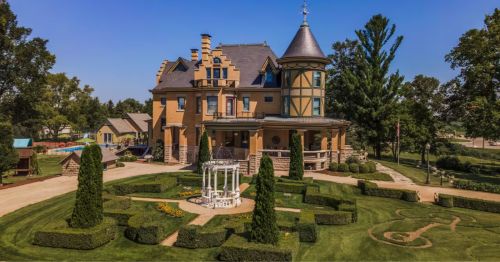 A Victorian-era home with a manicured garden.